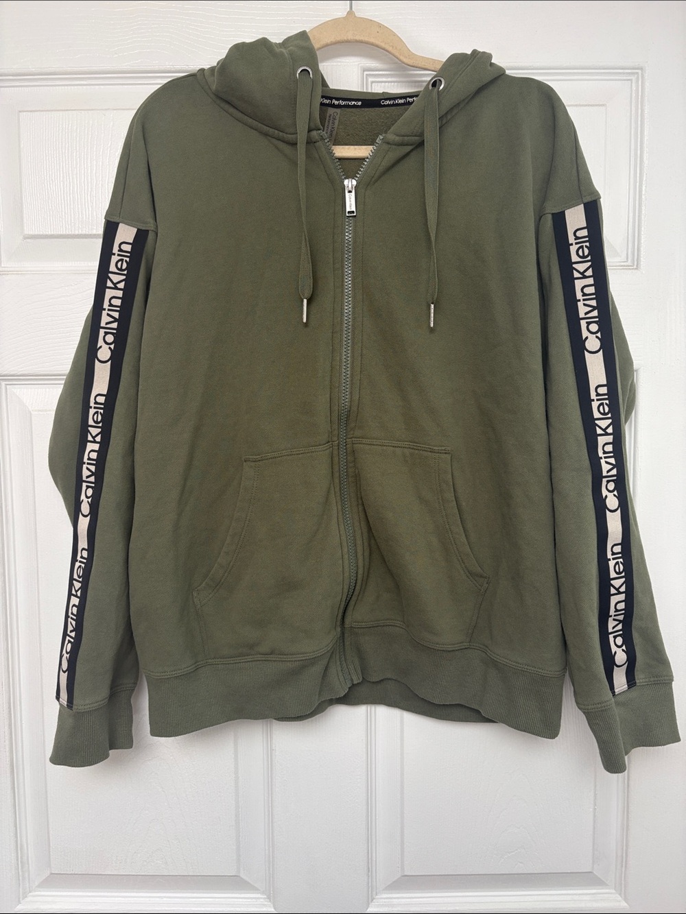 zip-up performance sweater.